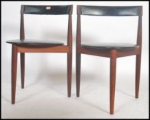 A pair of mid century Danish teak wood dining chairs designed by Hans Olsen for Frem Rojle. Black