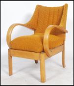 A vintage Art Deco bentwood wing back fireside armchair. Upholstered in a vibrant orange woolen