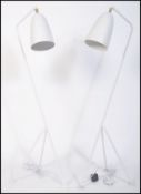 After Greta Grossman, a fabulous pair of large white grasshopper floor lamps. Having a tubular steel