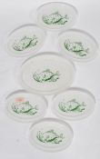 A collection of six vintage fish plates and matching serving plate by Phoenix ( Pyrex ) each milk