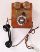 A vintage 20th century Wooden cased GPO telephone with ring dialer and original handset. THe rear of