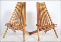 A pair of vintage 20th century metamorphic Congo chairs constructed from sectional pieces of varying