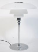 After Poul Henningsen. A stunning PH80 model table lamp having chrome terraced base and support with