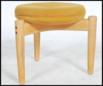 A good mid century design stool being raised on shaped leg base united by returns of cross form