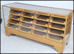 A stunning early 20th century Art Deco twenty drawer vintage haberdashery shop display cabinet