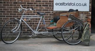 An original Indian / Thai rickshaw with the original paintwork and emblem with makers plaque.