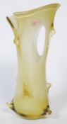 A large 20th century Murano glass Empoli vase of pierced form being handblown and in a stunning