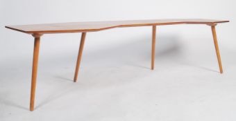 A good mid century large teak wood believed British arts designer 1950's boomerang coffee table of