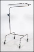 An original mid century Industrial surgeons raised  trolley tray stand of tubular metal and
