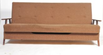 A 1970's - mid century original teak Danish influence sofa day bed in the manner of Scandart. The