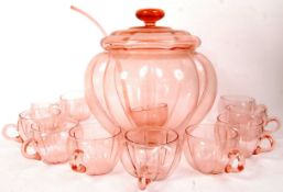 A retro 1950's pumpkin shaped cranberry flash glass coloured punch bowl and lid complete with the