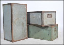 A good stack of early 20th century storage - shipping crates of metal construction bearing