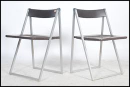 A pair of original 1970's / 1970's Italian stainless steel and brown resin cast Interlubke folding