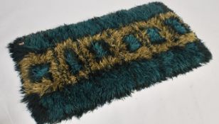 A stunning retro 1970's 20th century crochet floor rug, the crochet rug having a deep shag pile