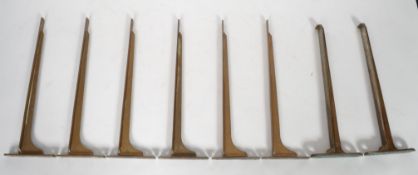 A collection of original early 20th century shop / Industrial solid bronze wall shelf  brackets (