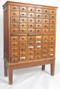 An exceptional early 20th century large Industrial oak index filing cabinet on stand. Raised on a