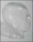 A 20th century art deco style moulded pressed glass phrenology type head - shop display stand /
