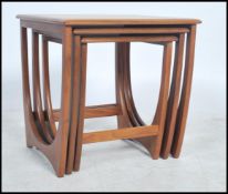 A 1970's G-Plan ' Astro ' teak wood nest of tables. The tables of graduating form with each being