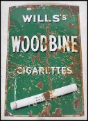 An original early 20th century enamel advertising sign for Wills Woodbine Cigarettes The sign