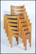 A set of 6 beech and vinyl upholstered stacking and interlocking chairs by Clive Bacon dating to the
