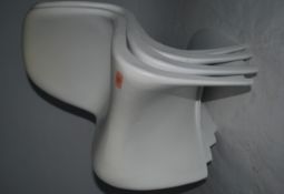 A set of eight contemporary 20th cenury childrens white Verner Panton S Shaped dining chairs