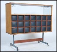 A 1970's Barget cocktail bar / cabinet with original metal cage bottle holders, the unit being