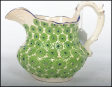 A very pretty mid 19th century Staffordshire cream