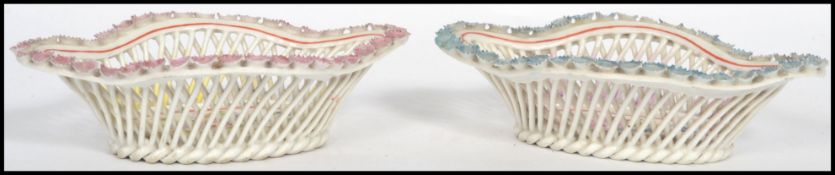 A pair of 19th century ceramic ribbon pin dishes,