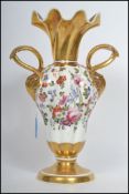 An early 19th century English porcelain twin handl