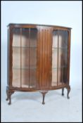 An Edwardian oak twin door display cabinet, fitted