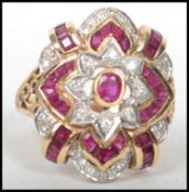 An 18ct yellow gold ladies ruby and diamond ring c