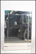 A contemporary Venetian style wall mirror of bevel