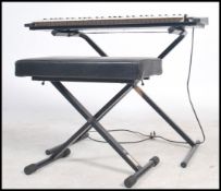 A retro 1970's Yamaha DX - 11 synthesizer / keyboa