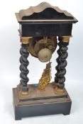 A French ormolu mounted ebonised portico mantel cl