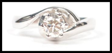 An 18ct white gold and diamond solitaire ring of f