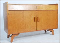 A 1970's retro teak wood sideboard dresser raised