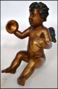 An early 20th century bronze cherub winged putti m