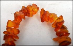 Two vintage baroque amber necklaces one having a b