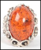 A 20th century large silver and amber adorned cock