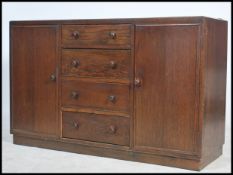 A 20th century vintage dark wood sideboard with a