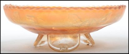 An early 20th century amber coloured carnival glas
