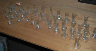 A good collection of small phial measures, each of