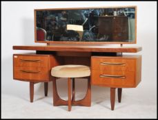 A 1970's G-Plan teak wood dressing table in the manner of Mogens Kolo. The dressing table raised