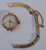 A vintage 20th century 9ct gold ladies cocktail watch set on a 9ct watch bracelet. Total weight 19.7