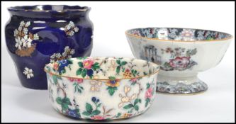 A collection of 19th century and other ceramics to include a blue ground planter with painted