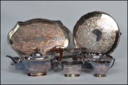 A vintage 20th century silver plated tea service together with a selection of silver plated trays,