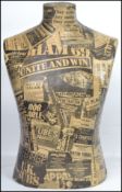 A 20th century shop counters / haberdashery / dress makers bust having applied headlines and news