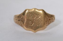 A vintage 9ct gold gents signet ring with gypsy style chase shoulders, monogram to the cartouche.