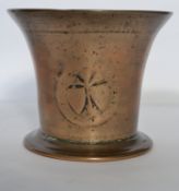 A heavy bronze mortar dating to the late 17th early 18th century with indistinct heraldic device