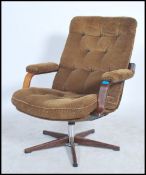 A 1970's brown corduroy swivel easy lounge armchai